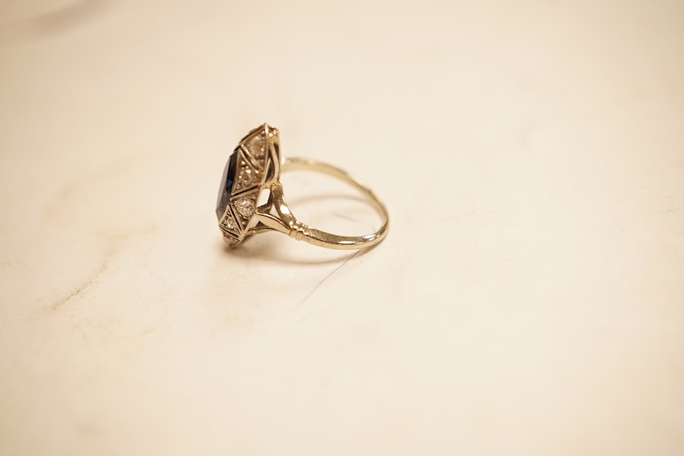 A 1920's style white metal, sapphire and diamond cluster set navette shaped ring, size G, gross weight 2.4 grams.